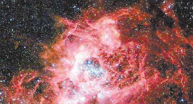 Imagem tirada do telescópio Hubble mostra nuvem de gás se dissipando e dando origem a milhares de estrelas jovens (Nasa/AFP - 17/12/12
)