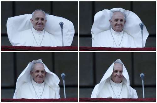 Vento levanta manto do papa Francisco e o cobre como se fosse um véu. O fato ocorreu após o pontífice celebrar a missa neste domingo (7/4) de posse da cátedra de bispo de Roma, na Basílica de São João de Latrão