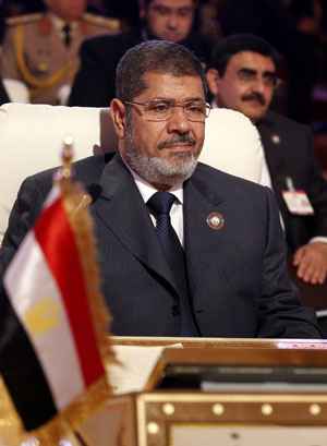 Mohamed Mursi participa da abertura da cúpula da Liga Árabe na capital do Qatar, Doha