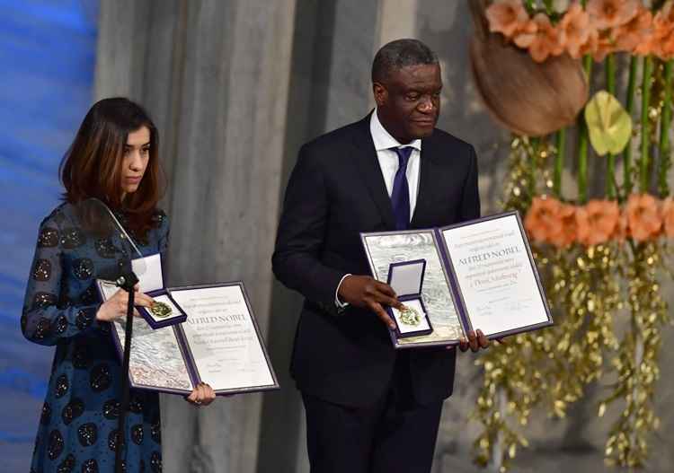 Iraqi Yazidi-Kurdish human rights activist and co-laureate of the 2018 Nobel Peace Prize Nadia Murad and Congolese gynecologist and co-laureate of the 2018 Nobel Peace Prize Denis Mukwege pose after they were given their awards during the Nobel Peace Prize ceremony 2018 on December 10, 2018 at the City Hall in Oslo, Norway