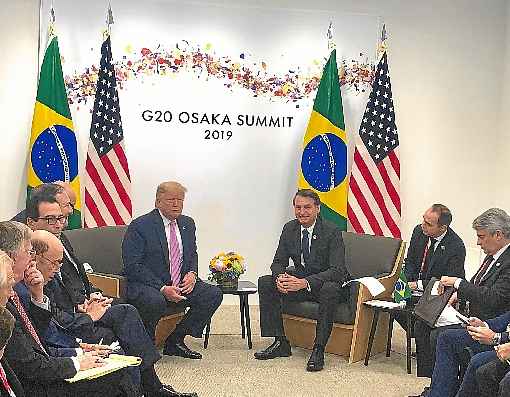 Trump e Bolsonaro durante encontro bilateral do G20, no Japão: relação positiva ainda está longe de ajudar o Brasil